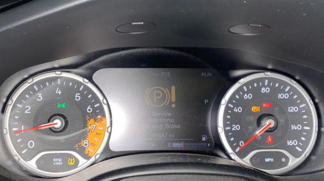 Service Electronic Parking Brake warning on the Jeep Compass dashboard screen